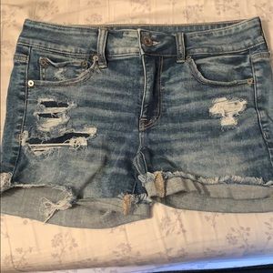 Distressed American Eagle midi jean shorts